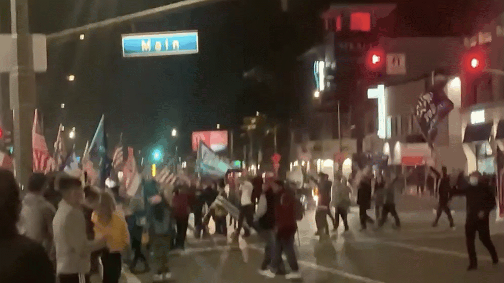 "Burn That Mask! Burn That Mask!" - Huntington Beach
Protesters March In Defiance Of California's New
Curfew 1