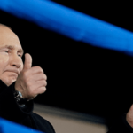 Putin Shamelessly Cheers for 'Banned' Russian Athletes at
Olympics 12