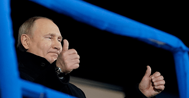 Putin Shamelessly Cheers for 'Banned' Russian Athletes at
Olympics 1